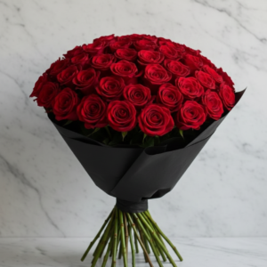 Fresh Pakistani red roses in luxury black wrapping by Gull Flowers.