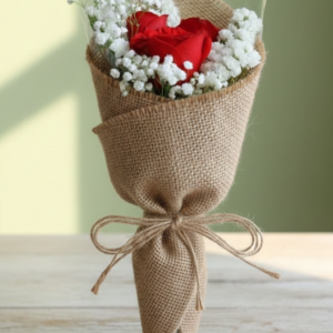 Single red rose in jute wrapping with gypso by Gull Flowers.